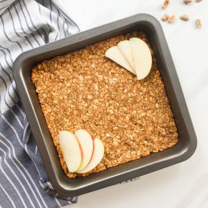 Baked oatmeal in a black baking pan.