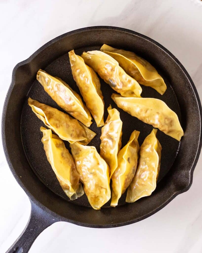 Cooking dumplings in a cast iron skillet