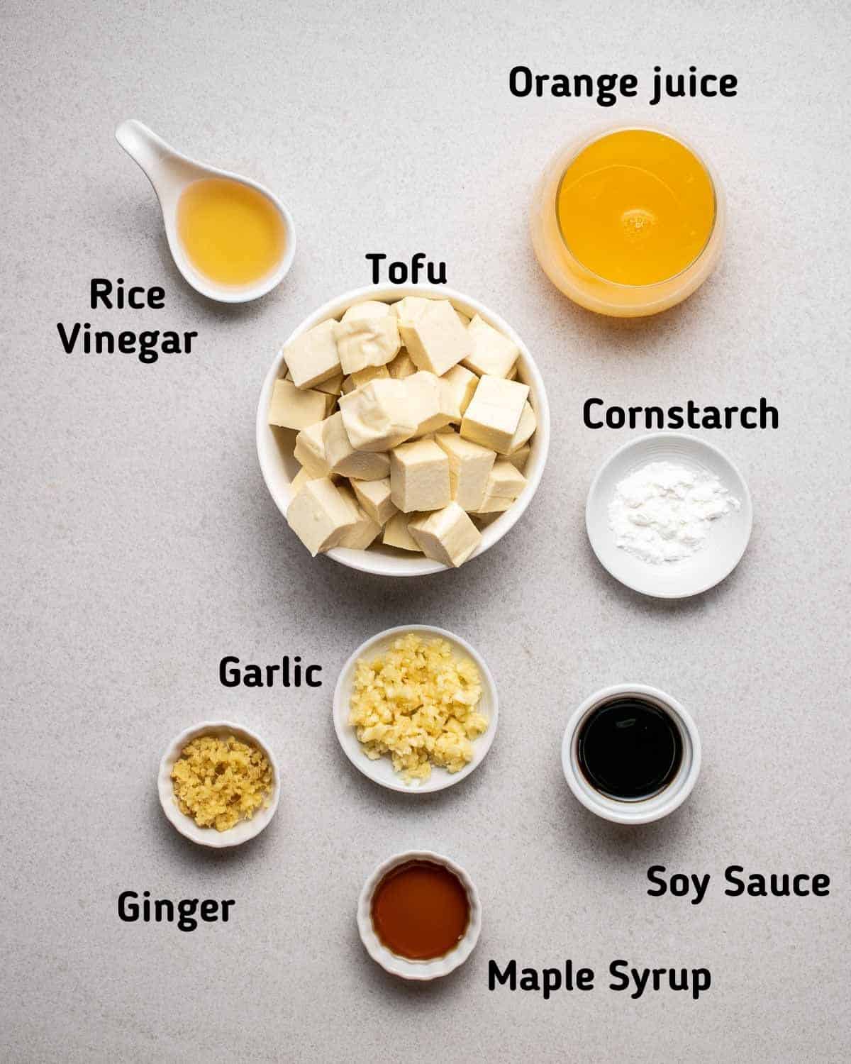 Ingredients needed like tofu, orange juice, garlic, ginger, cornstarch and other seasonings.