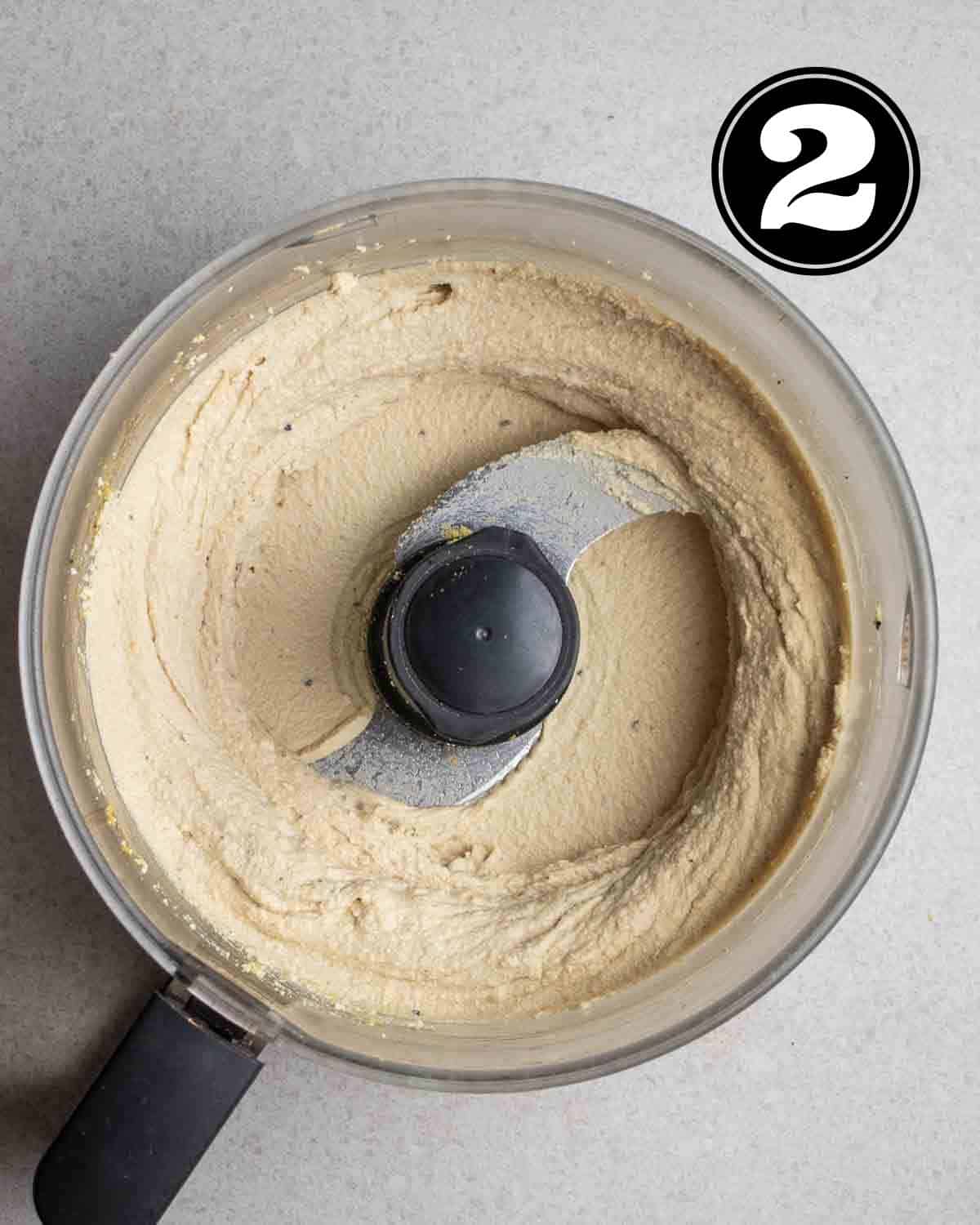 Blended tofu ricotta in a food processor.