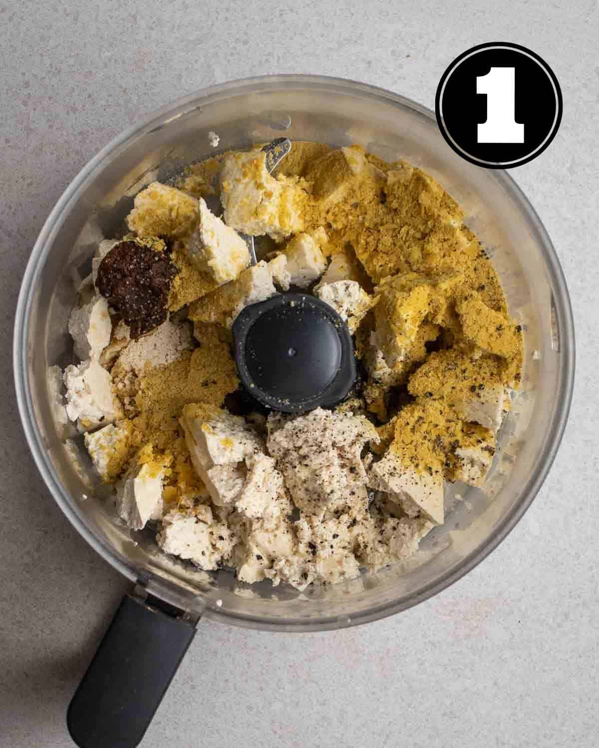 Ingredients for tofu ricotta in a food processor.