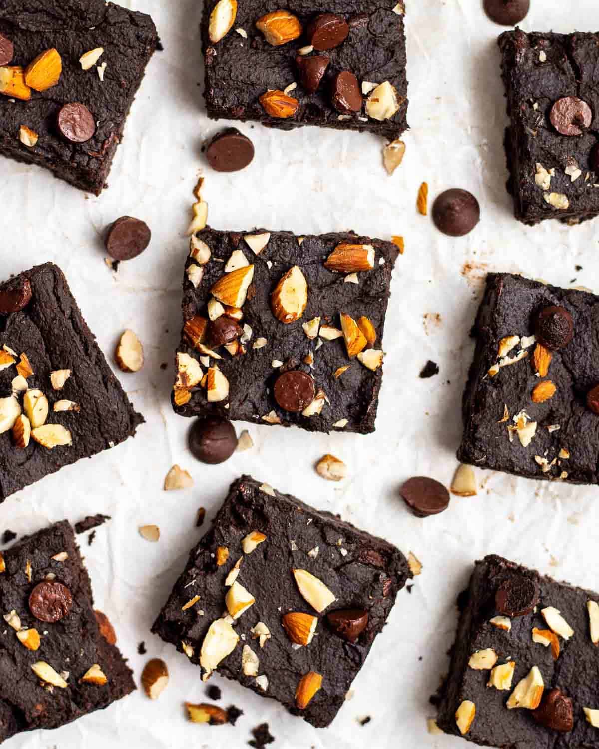 Slices of protein brownies arranged on a parchment paper.