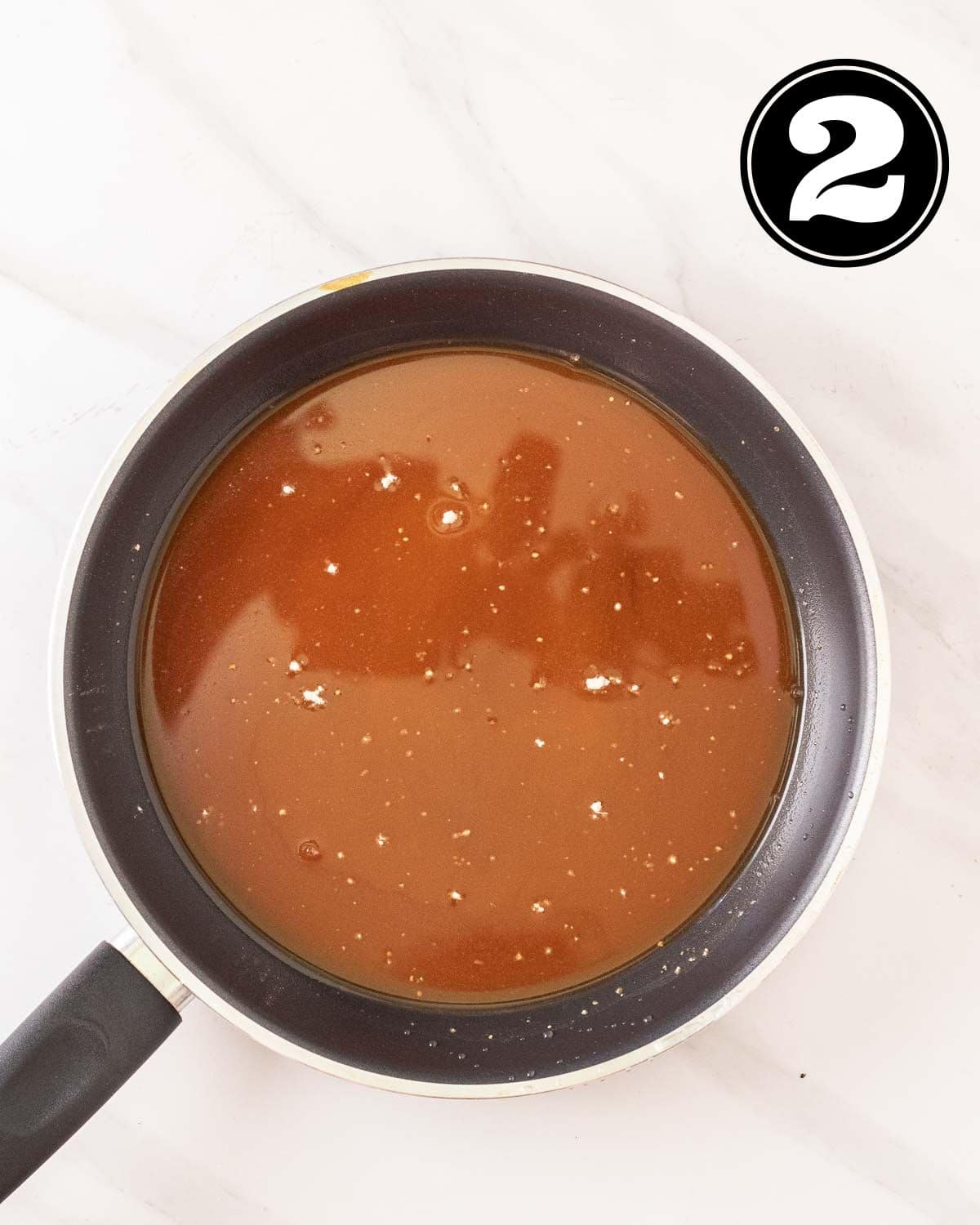 A pan of uncooked teriyaki sauce.