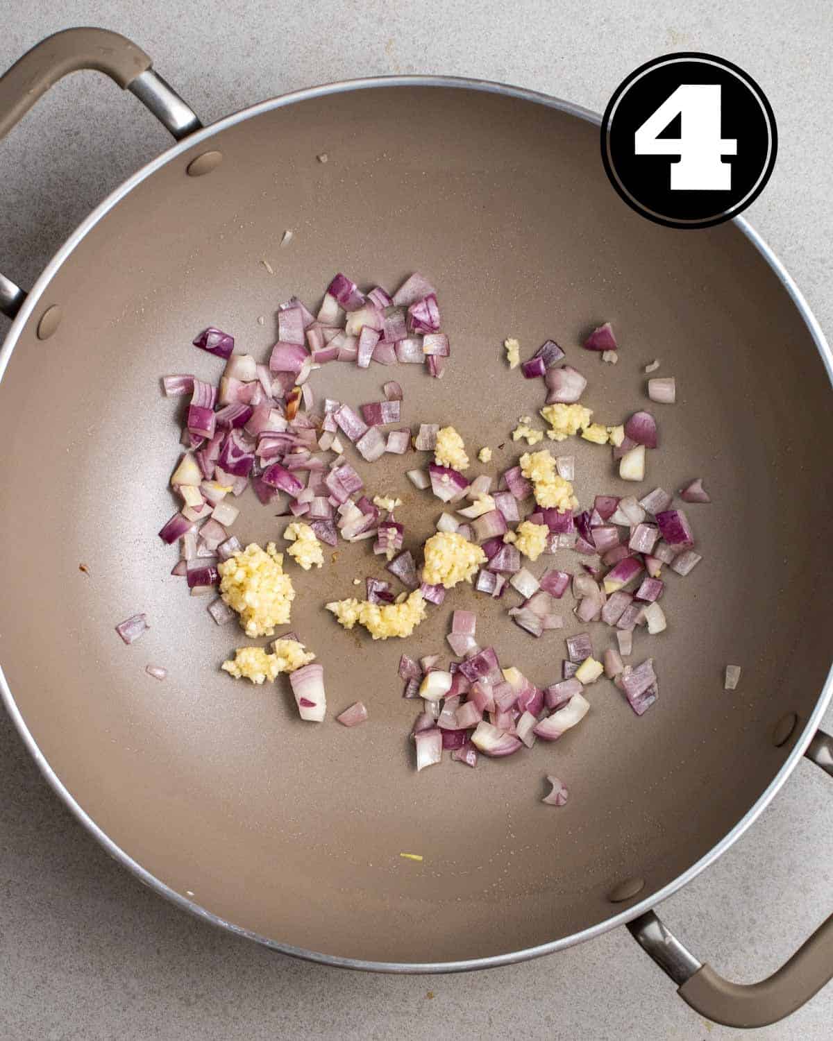 Fried ginger and garlic in a wok.