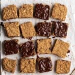 Slices of protein flapjacks arranged on a parchment paper.