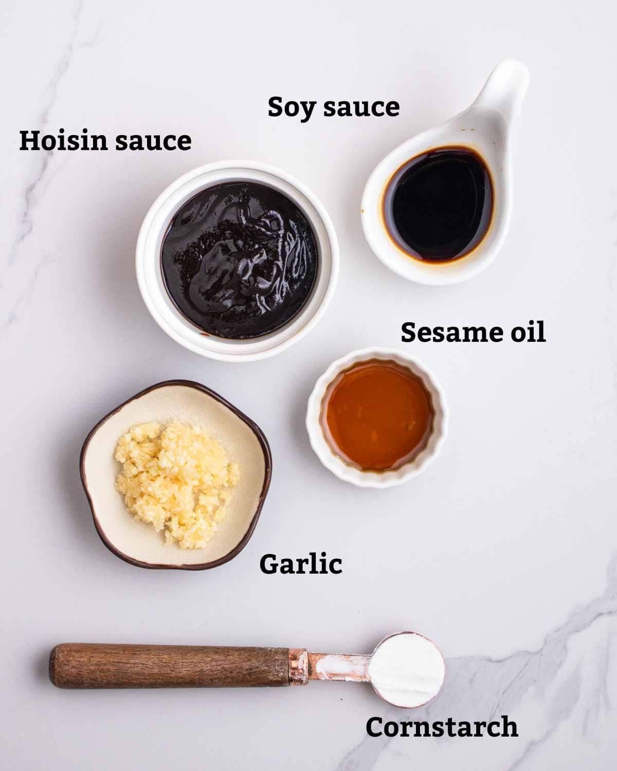 Ingredients needed for sauce such as hoisin sauce, soy sauce, garlic, sesame oil, and cornstarch.