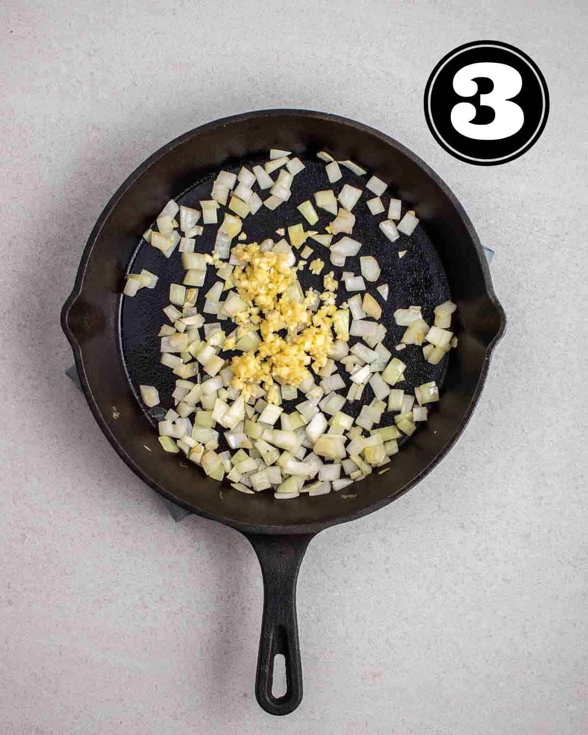 Cooked onion and garlic in a cast iron skillet.