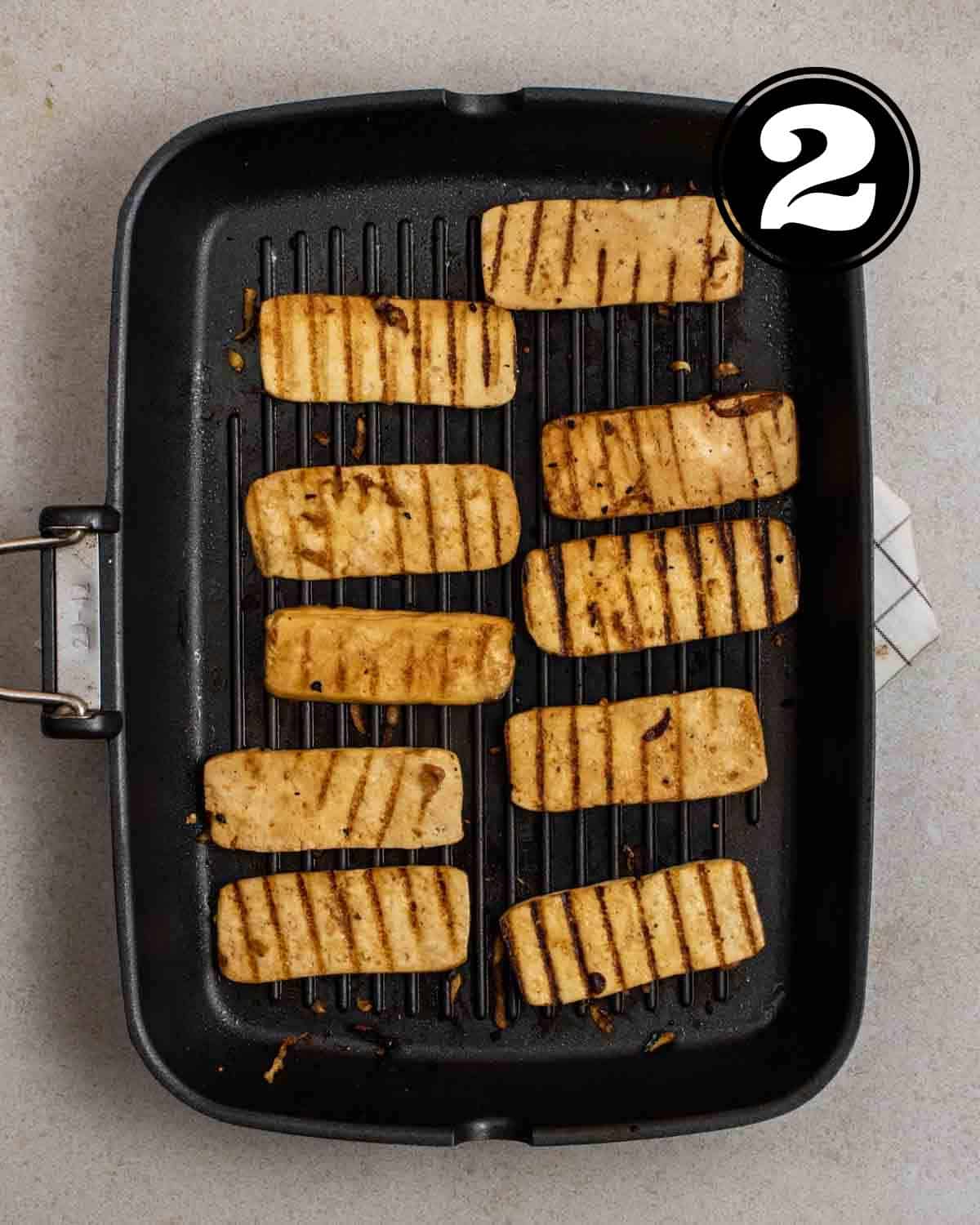 Cooking tofu bulgogi in a grill pan.
