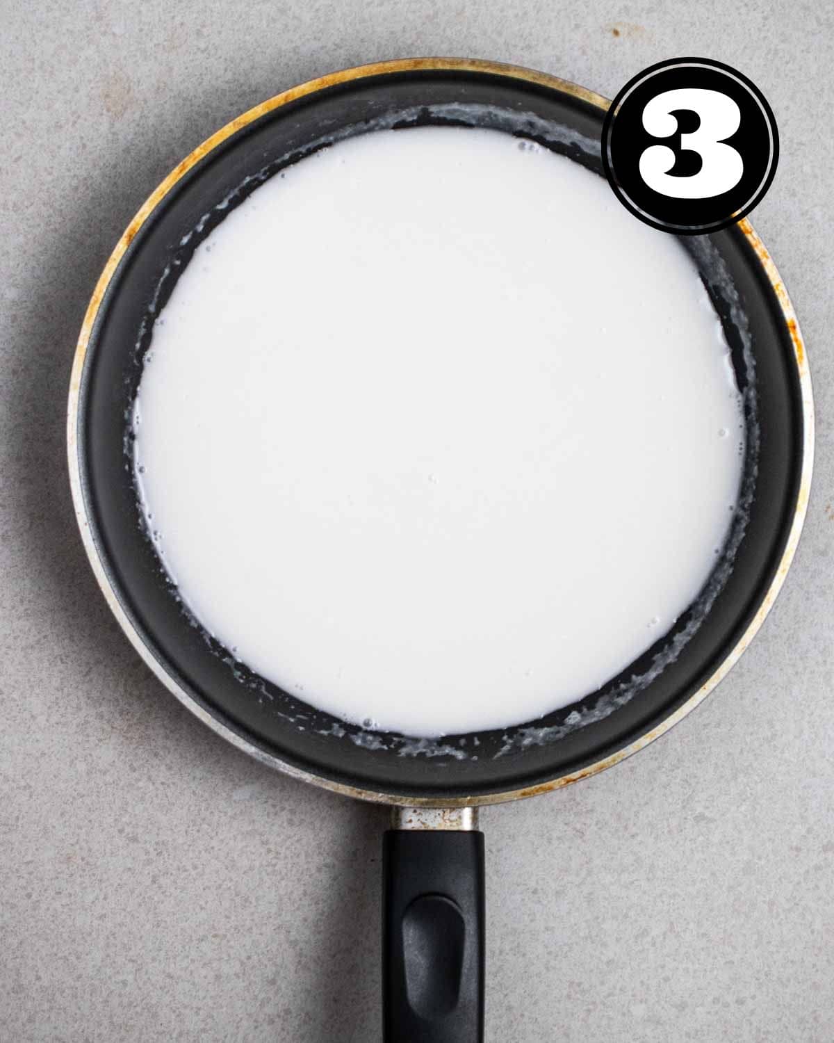 Coconut sauce in a non-stick pan.