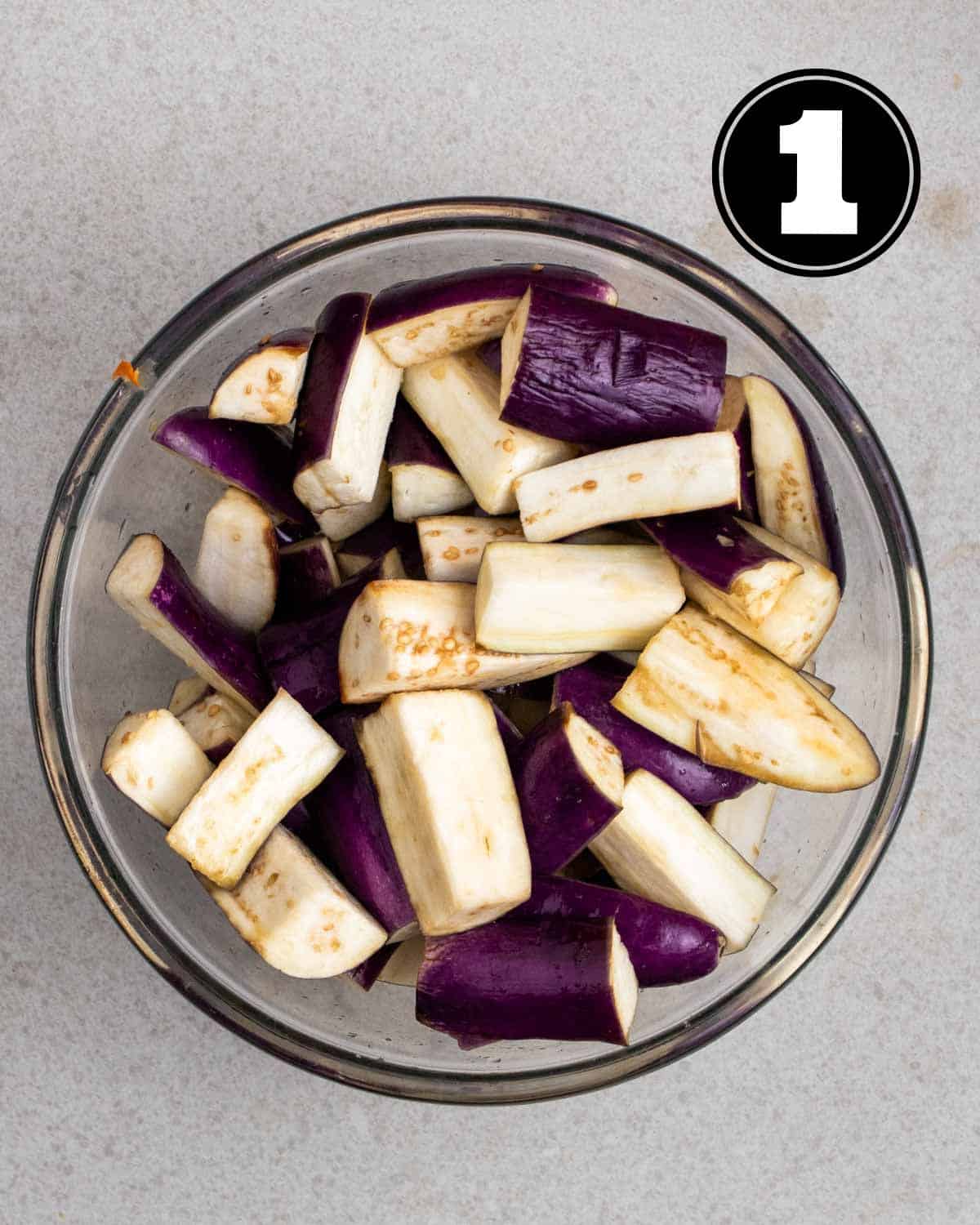 Salted eggplant in a glass bowl.