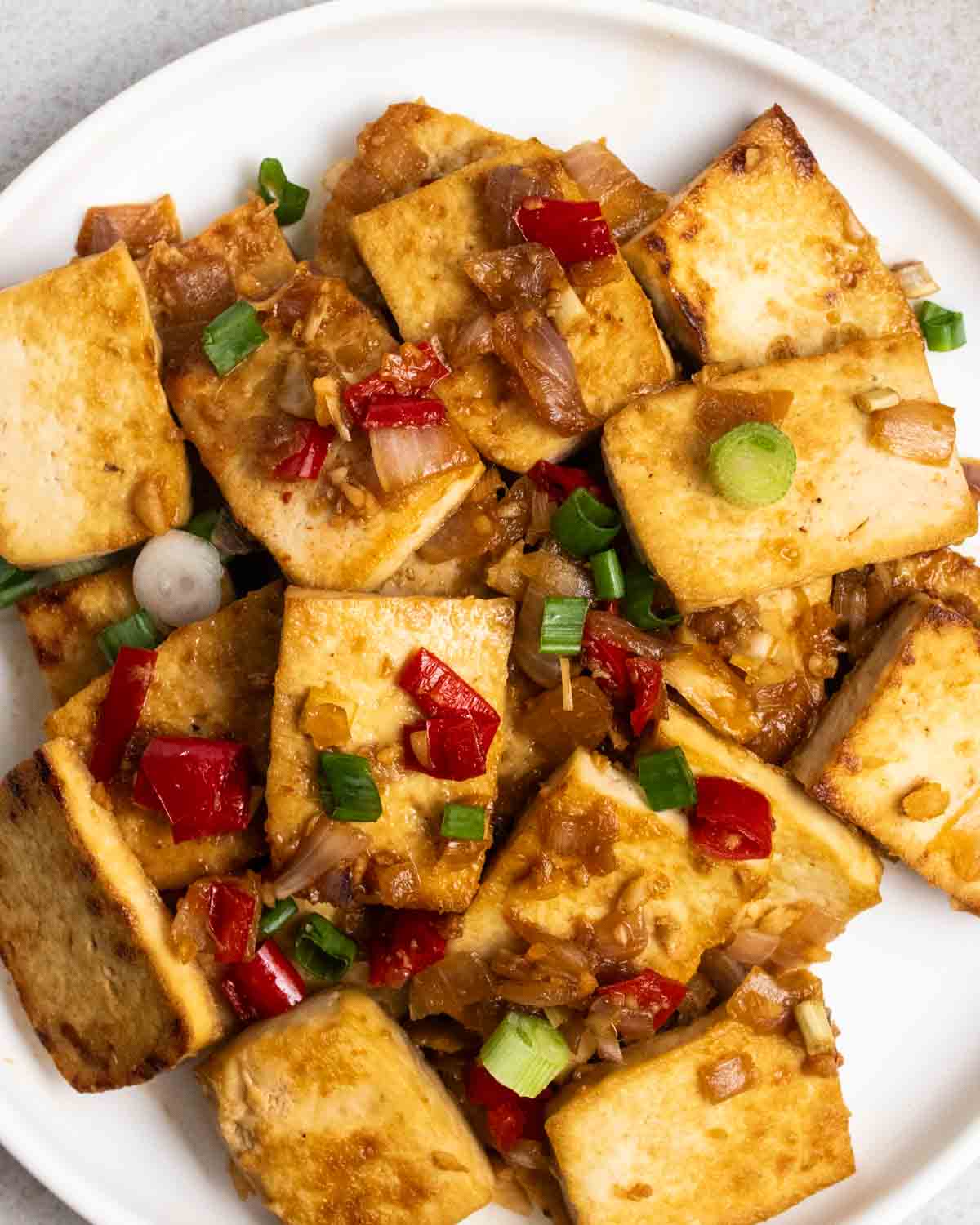 Lemongrass tofu served on a white plate.