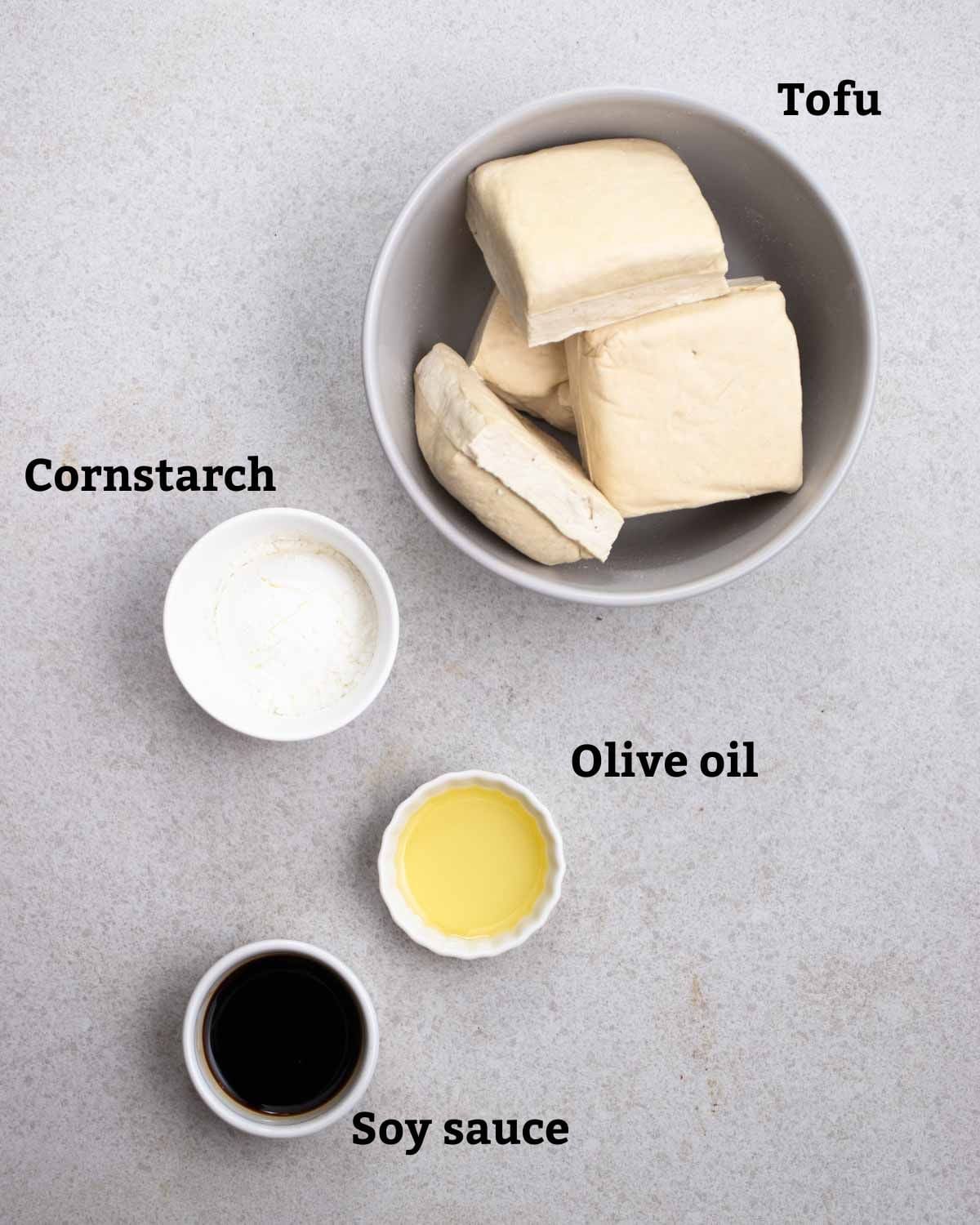 Ingredients needed like tofu, cornstarch, olive oil, and soy sauce.