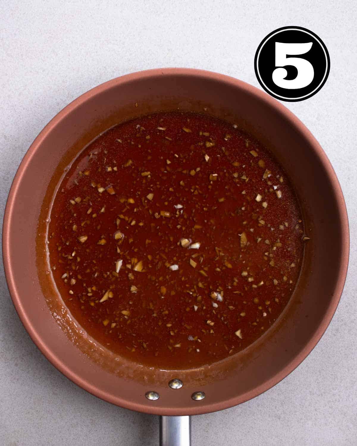 Teriyaki sauce in a non-stick pan.