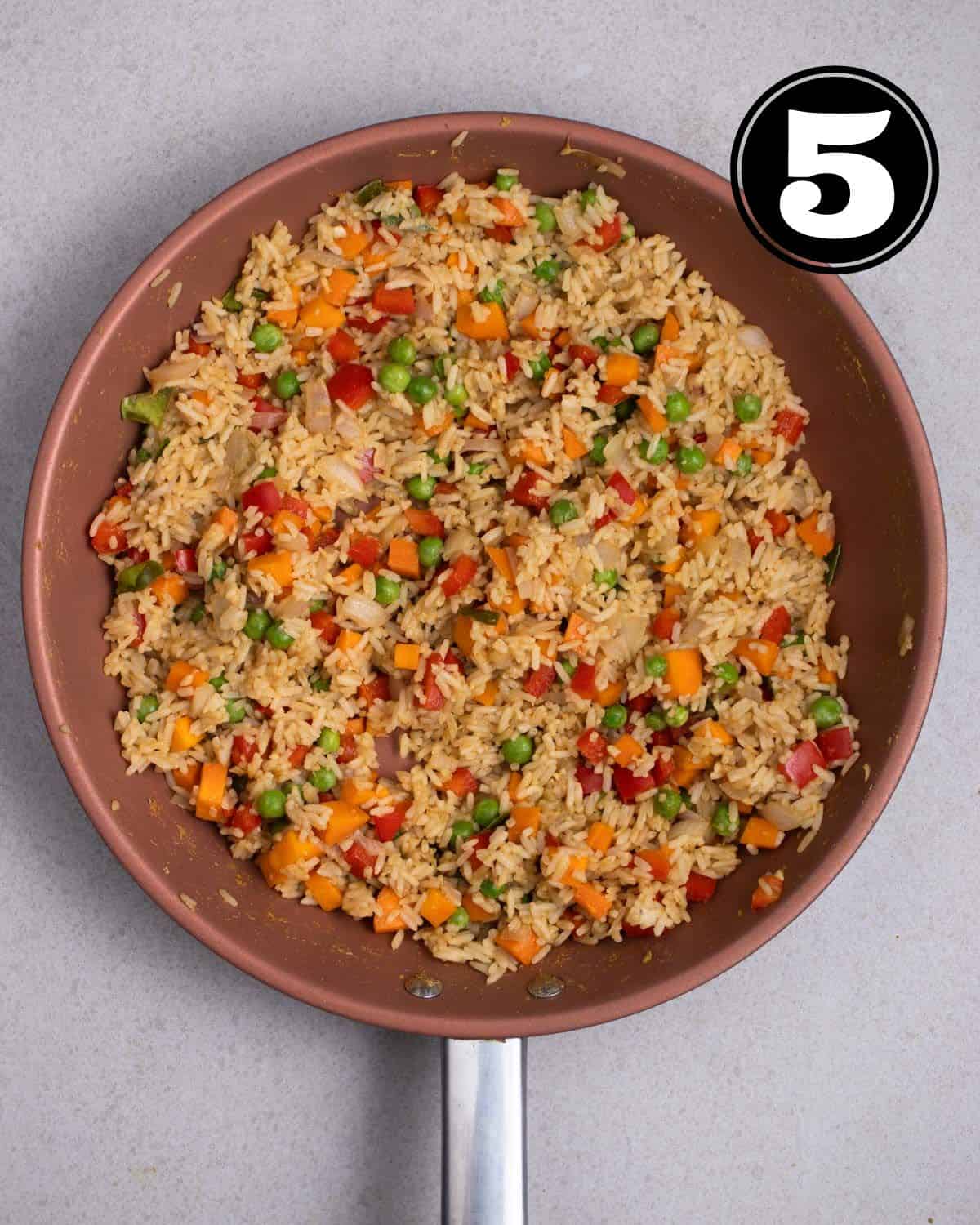 Curry fried rice in a non-stick pan.