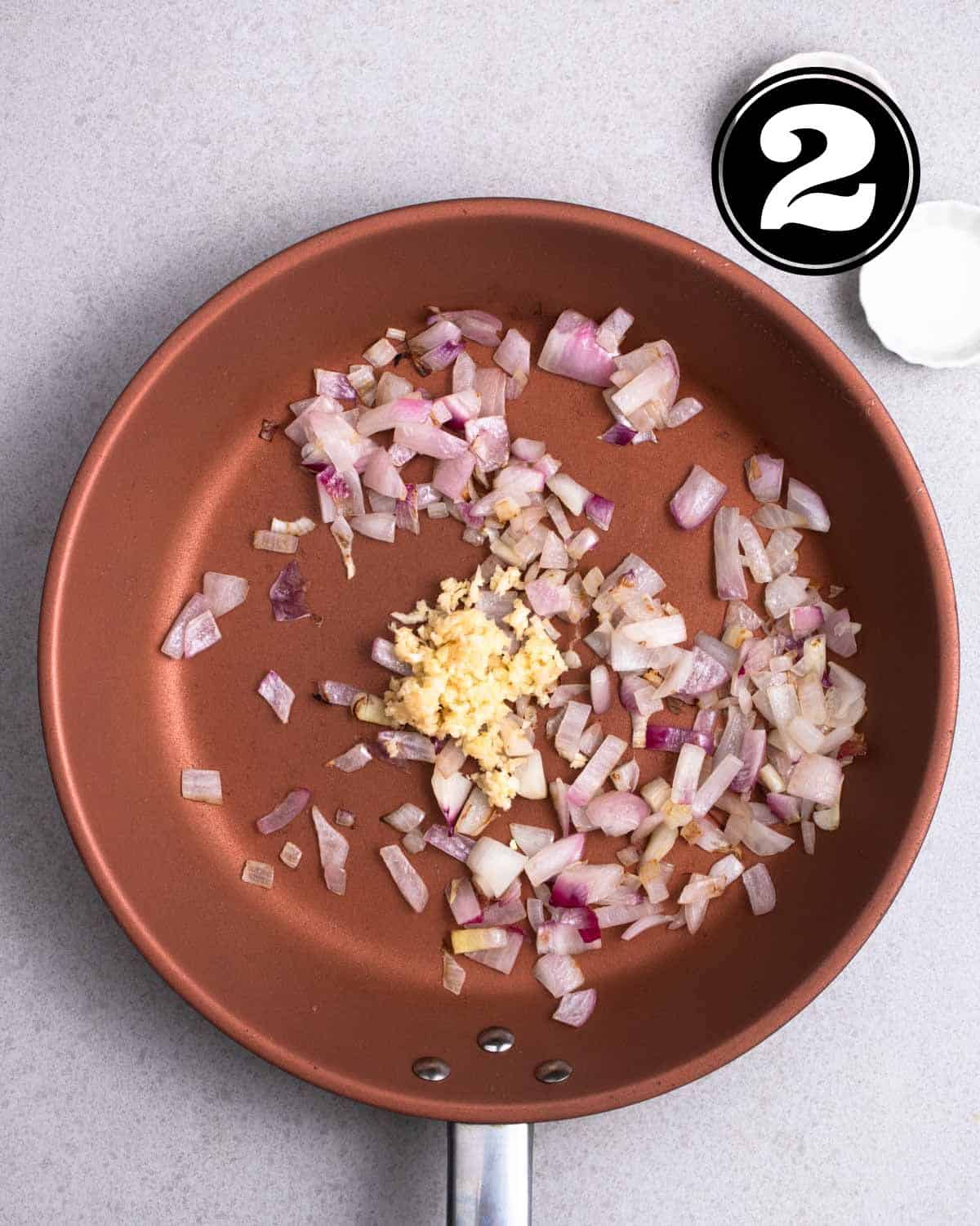 Cooked onion and garlic in a non-stick pan.