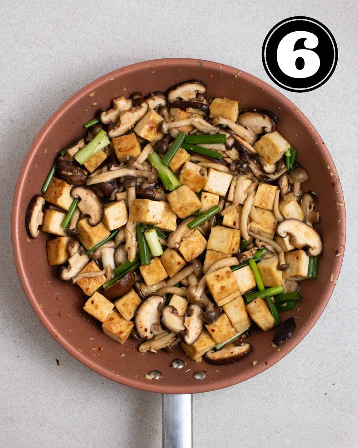 Mushroom tofu stir-fry in a non-stick pan.