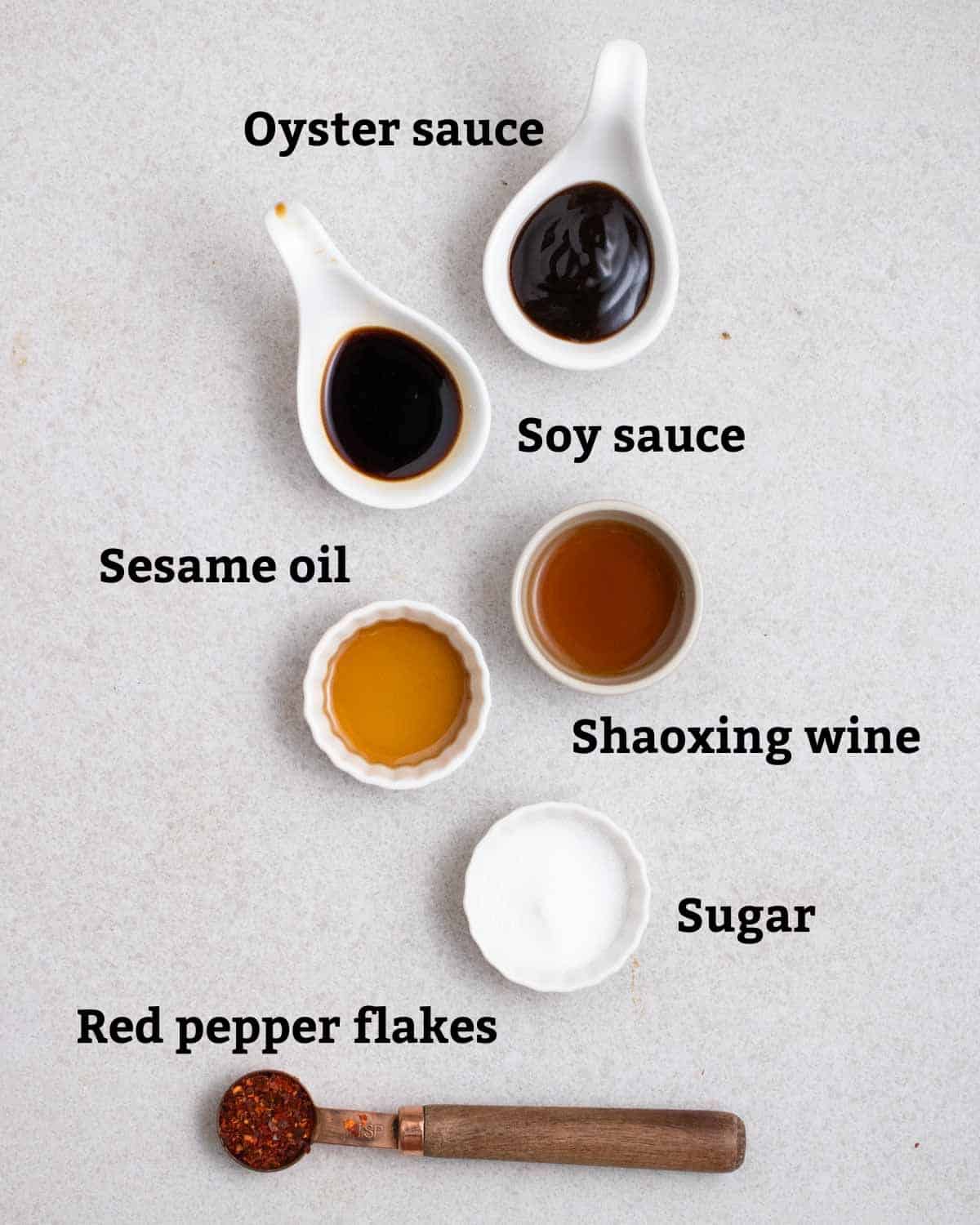 Ingredients needed for sauce like oyster sauce, soy sauce, shaoxing wine, sesame oil, sugar, and red pepper flakes.