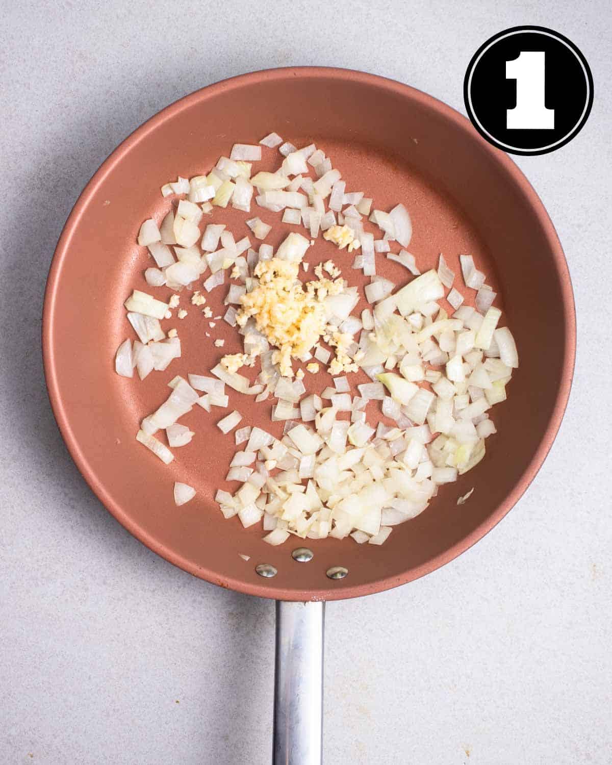 Cooked onion and garlic in a non-stick pan.