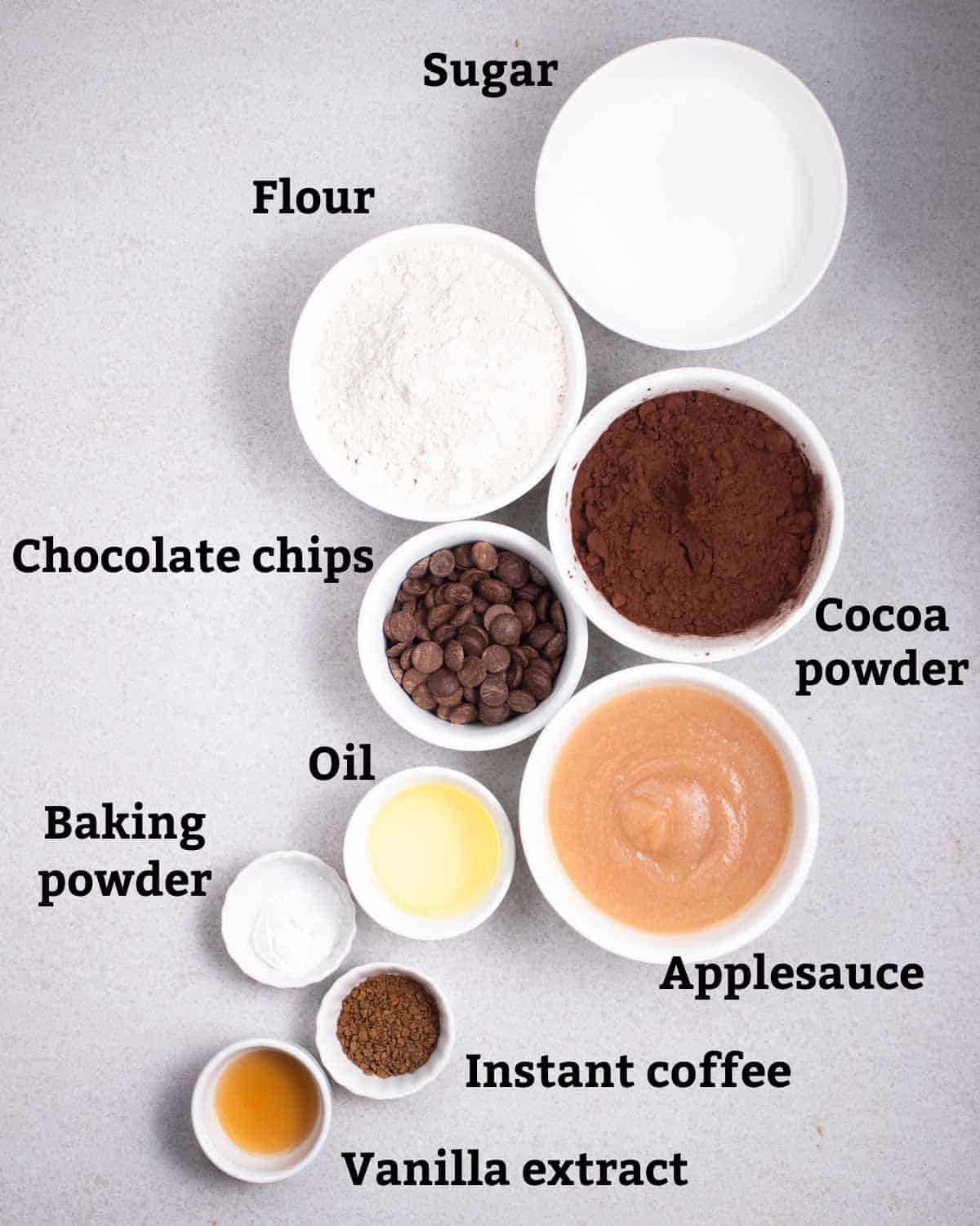 Ingredients needed like oat flour, sugar, chocolate chips, cocoa powder, applesauce, and other ingredients.