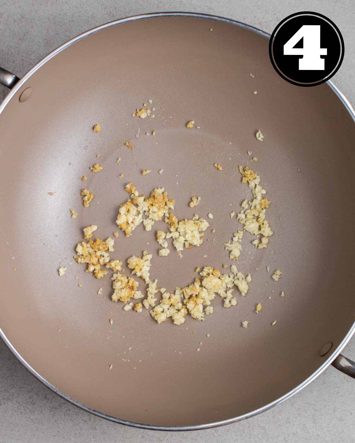 Cooked ginger and garlic in a wok.