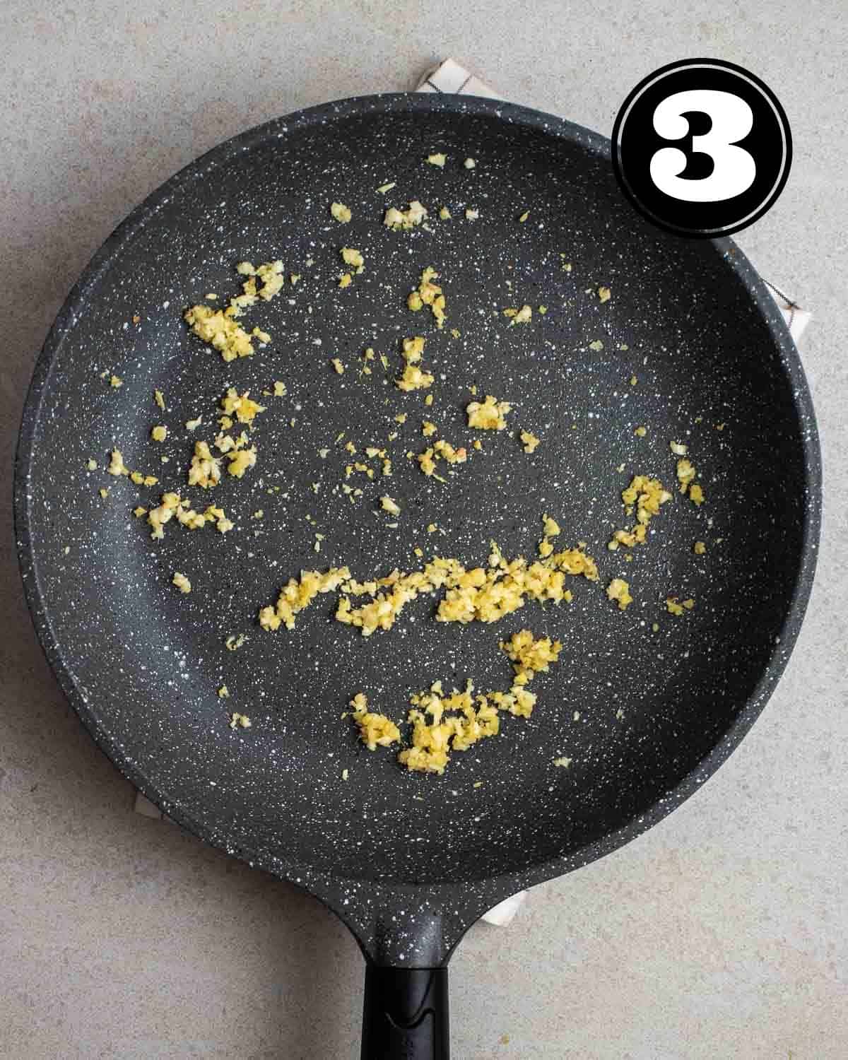 Cooked ginger and garlic in a pan.