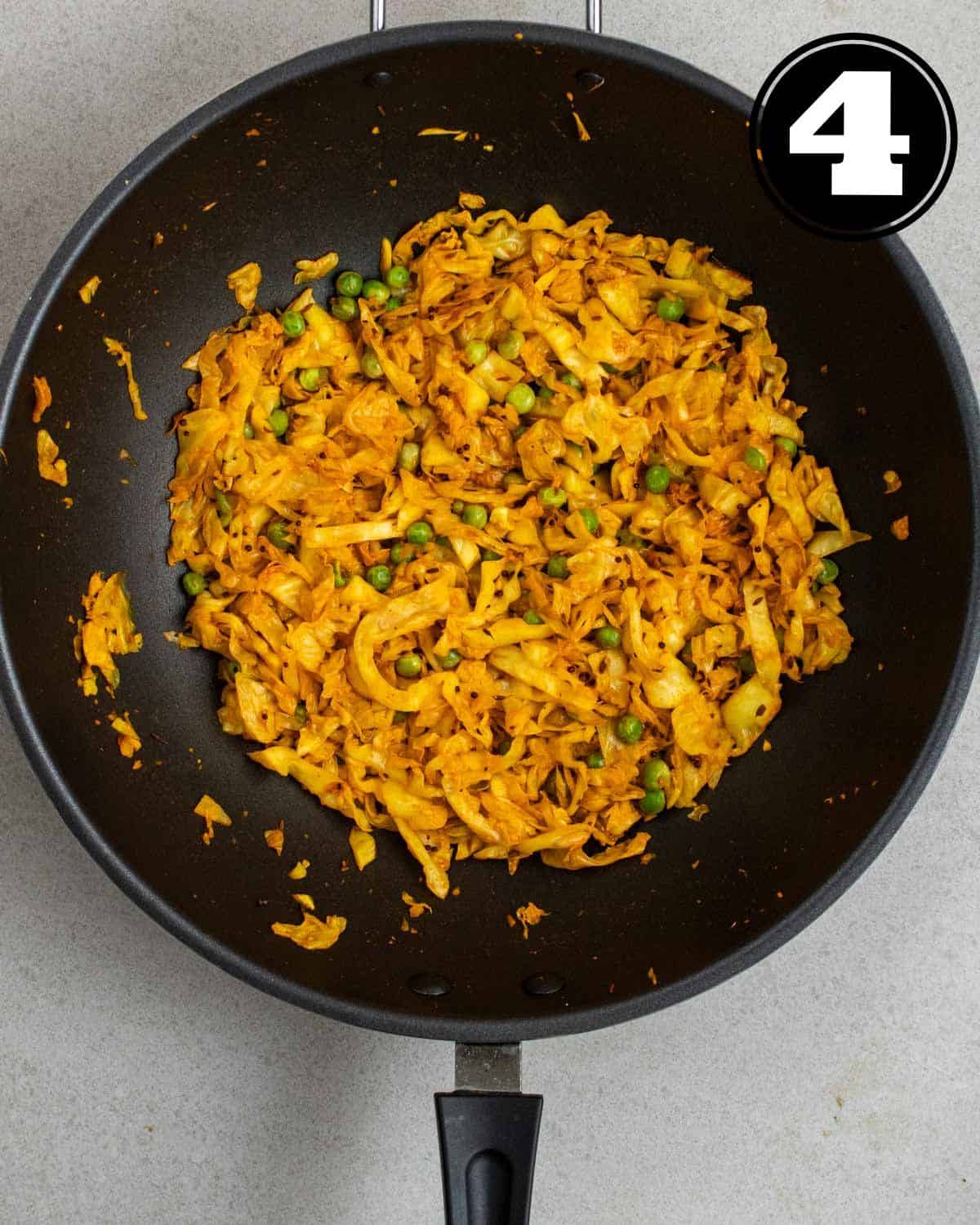 Cabbage curry in a wok.