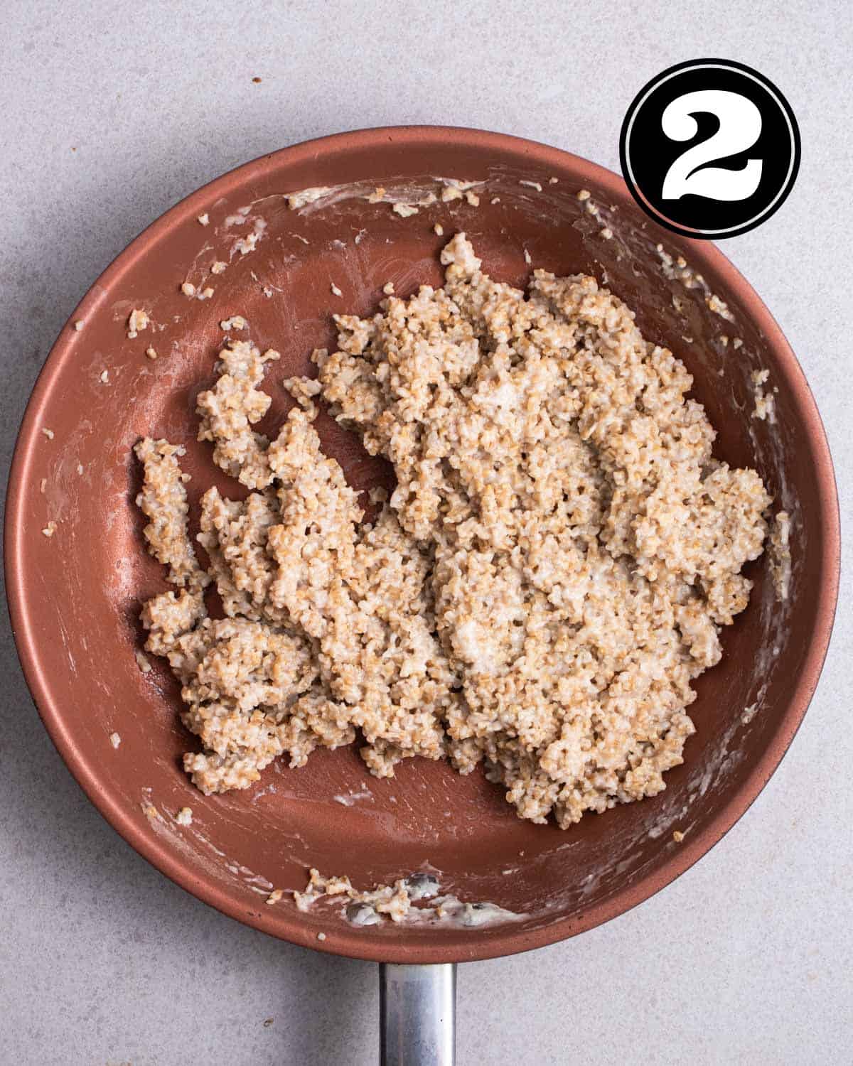Cooked steel cut oats in a pan.