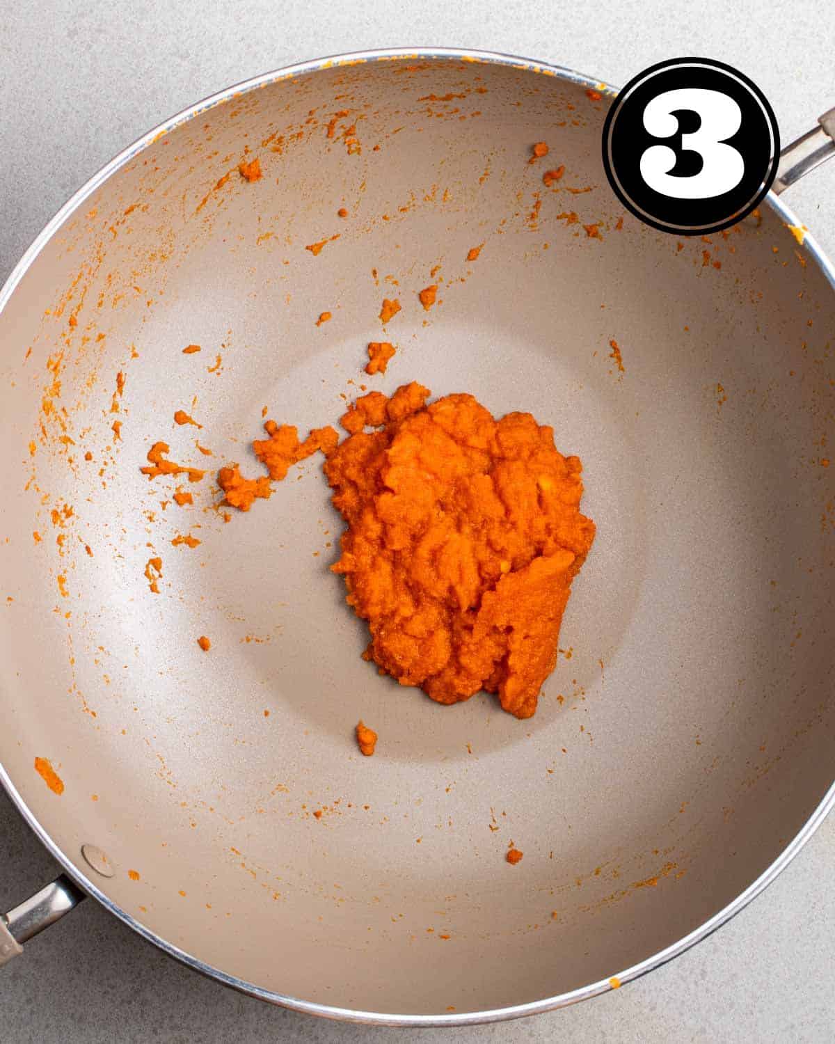 Cooked chili paste in a wok.